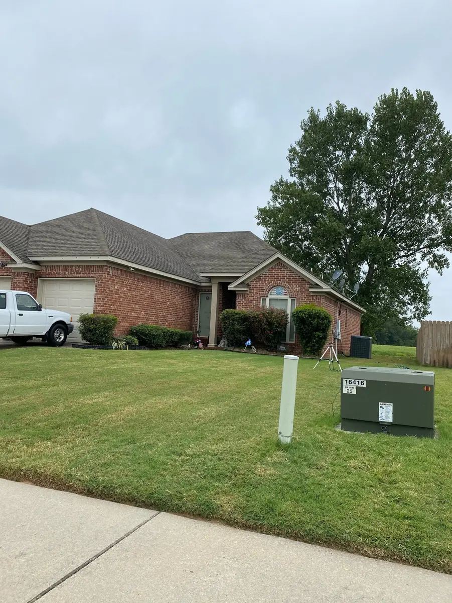 Completed asphalt shingle roof on a brick home in Central Arkansas by Hero Roofing