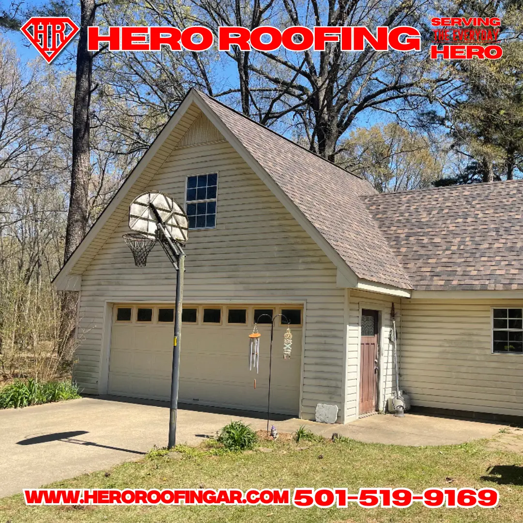 Completed asphalt shingle roof on a home with siding and an attached garage in Central Arkansas by Hero Roofing